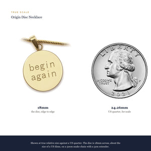 True scale: the 18mm Origin Disc beside a US quarter, about the size of a dime