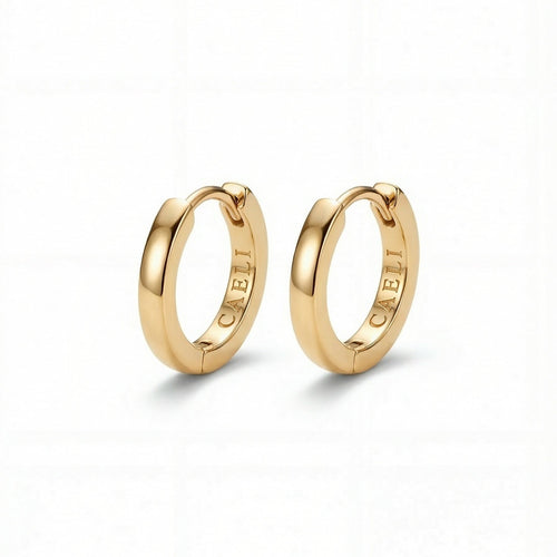 Daylight Huggies small gold hoop earrings 14K gold plated 316L surgical steel hypoallergenic Caeli Jewelry limited edition
