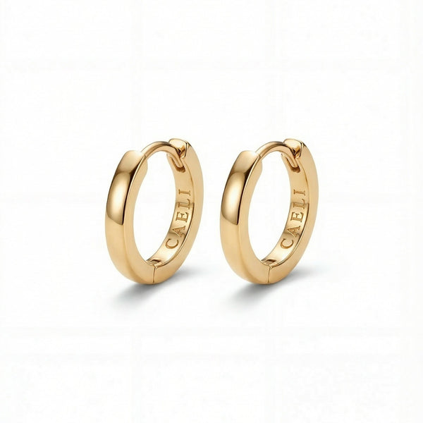 Daylight Huggies small gold hoop earrings 14K gold plated 316L surgical steel hypoallergenic Caeli Jewelry limited edition