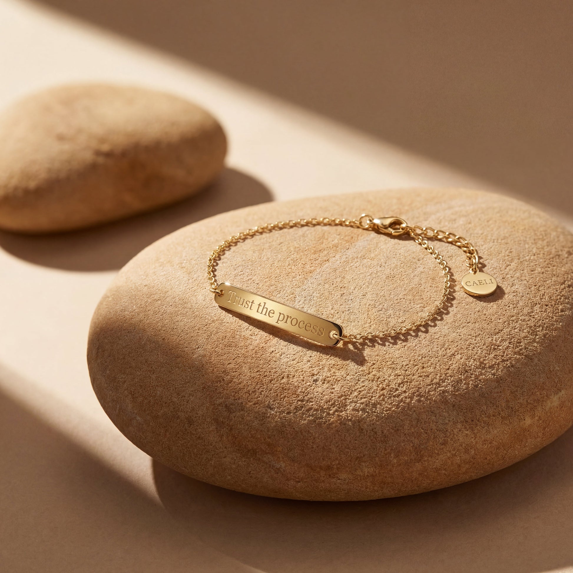 14K gold plated engraved bar bracelet reading Trust the Process on smooth stone, hypoallergenic chain bracelet by Caeli Jewelry
